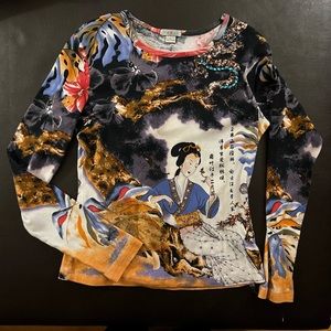 Unique cotton knit shirt with Asian designs.
